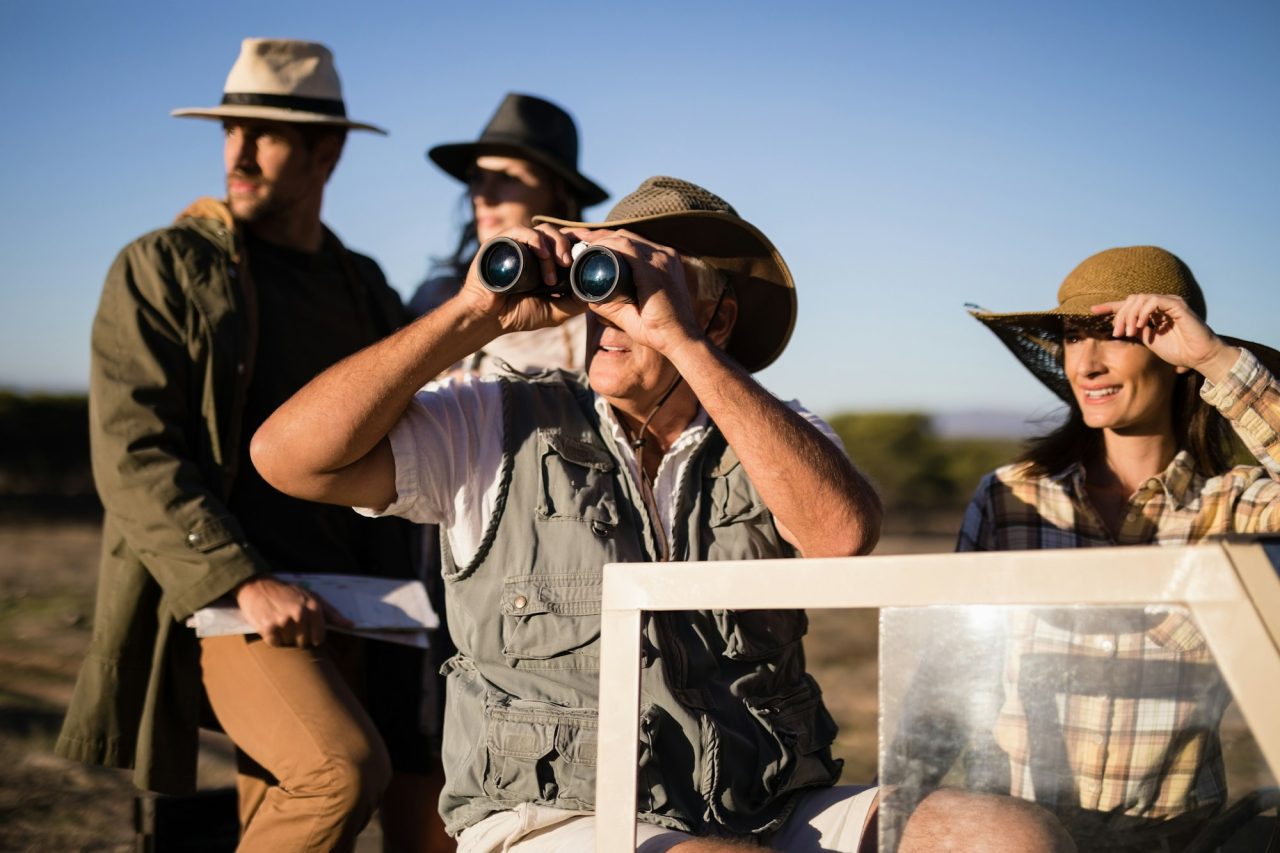 happy-friends-enjoying-in-vehicle-during-safari-vacation.jpg